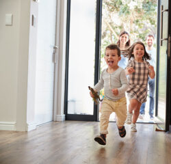 family running into their home excited about better indoor air quality with air purification